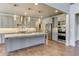 A spacious kitchen features stainless appliances, pendant lighting, and a large island with a marble countertop at 3065 Reserve Ct Sw, Conyers, GA 30094