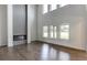 Living room with tall ceilings, fireplace, and multiple windows at 3065 Reserve Ct Sw, Conyers, GA 30094