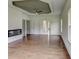 Open-plan living room offers hardwood flooring, ample natural light, and a modern fireplace at 3065 Reserve Ct Sw, Conyers, GA 30094
