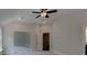 Bedroom with neutral walls and carpets, vaulted ceilings, and multiple windows and doorways at 3292 Mill Forest Dr, Conyers, GA 30094