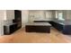 Spacious kitchen with dark wood cabinets, granite counters, and a large center island at 3292 Mill Forest Dr, Conyers, GA 30094