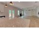 Open floor plan with kitchen and living room, featuring granite countertops and stainless steel appliances at 3292 Mill Forest Dr, Conyers, GA 30094