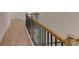Elegant staircase with wooden banister and hardwood flooring leading to the upper level at 3292 Mill Forest Dr, Conyers, GA 30094