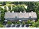 Aerial view of townhomes with lush greenery, offering a serene living environment at 661 Lockton Pl, Sandy Springs, GA 30342