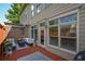 Relaxing back porch featuring comfortable outdoor seating and a view of the surrounding landscape at 661 Lockton Pl, Sandy Springs, GA 30342