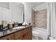 Inviting bathroom showcasing granite vanity, shower-tub with tile surround, and stylish fixtures for a relaxing experience at 661 Lockton Pl, Sandy Springs, GA 30342