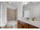Cozy bathroom with a shower-tub combination and wooden vanity at 661 Lockton Pl, Sandy Springs, GA 30342