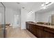 Modern bathroom features a double vanity, soaking tub, and a large mirror at 661 Lockton Pl, Sandy Springs, GA 30342