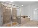Beautiful bathroom featuring a glass shower and soaking tub with tile surround at 661 Lockton Pl, Sandy Springs, GA 30342