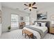 Bedroom featuring a comfy bed, bench, and two bright windows at 661 Lockton Pl, Sandy Springs, GA 30342