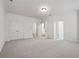Large bonus room with neutral carpeting and multiple door options at 661 Lockton Pl, Sandy Springs, GA 30342