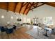 Interior view of a clubhouse with a vaulted ceiling, hardwood floors, and ample seating at 661 Lockton Pl, Sandy Springs, GA 30342