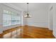 Light-filled dining room with hardwood floors, and large windows at 661 Lockton Pl, Sandy Springs, GA 30342