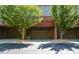 Townhome garages with brick facade and well-maintained surroundings at 661 Lockton Pl, Sandy Springs, GA 30342