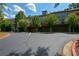 Townhome garages with a driveway and mature trees in a desirable location at 661 Lockton Pl, Sandy Springs, GA 30342