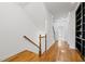 Bright hallway featuring hardwood floors and a custom built-in bookshelf at 661 Lockton Pl, Sandy Springs, GA 30342
