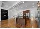 Open kitchen layout with hardwood floors, granite counters, and stainless steel appliances at 661 Lockton Pl, Sandy Springs, GA 30342