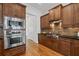 Gourmet kitchen with stainless steel appliances, granite countertops, and tile backsplash at 661 Lockton Pl, Sandy Springs, GA 30342