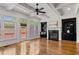 Bright living room boasts a fireplace, built-in bookshelves, hardwood floors, and deck access at 661 Lockton Pl, Sandy Springs, GA 30342