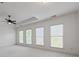 Spacious main bedroom with neutral carpets, ceiling fan, and lots of natural light at 661 Lockton Pl, Sandy Springs, GA 30342
