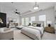 Staged main bedroom showcasing a cozy seating area and stylish decor at 661 Lockton Pl, Sandy Springs, GA 30342