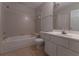 Bathroom featuring a toilet, tile floor, sink with vanity and mirror, and shower with wall tiles at 1015 Mcgill Park Ne Ave, Atlanta, GA 30312