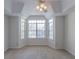 Bright bedroom featuring neutral carpet, a bay window, and a ceiling fan for comfortable living at 1015 Mcgill Park Ne Ave, Atlanta, GA 30312