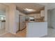 Well-lit kitchen featuring white cabinets and appliances, accented by a skylight above at 1015 Mcgill Park Ne Ave, Atlanta, GA 30312
