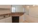 Cozy kitchen featuring stone countertops and a view into an open-concept living room at 1015 Mcgill Park Ne Ave, Atlanta, GA 30312