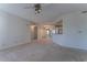 Open-concept living room featuring carpet flooring, multiple closets, and views to other rooms at 1015 Mcgill Park Ne Ave, Atlanta, GA 30312