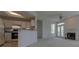 Bright living room featuring a fireplace, ceiling fan, and open access to the kitchen at 1015 Mcgill Park Ne Ave, Atlanta, GA 30312