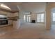 Inviting living room showcasing a fireplace, natural light, and seamless kitchen access at 1015 Mcgill Park Ne Ave, Atlanta, GA 30312