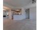 Spacious living room with fireplace, mirror accent wall, and adjacent kitchen view at 1015 Mcgill Park Ne Ave, Atlanta, GA 30312