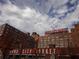 Exterior view of historic Ponce City Market with vibrant signage against a cloudy sky at 1015 Mcgill Park Ne Ave, Atlanta, GA 30312