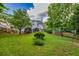 Lush green backyard with wooden fencing and mature trees, offering a serene outdoor space at 4174 Chatham Crest Ln, Buford, GA 30518