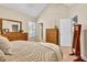 Cozy bedroom with vaulted ceiling, neutral decor, and plush carpeting at 4174 Chatham Crest Ln, Buford, GA 30518
