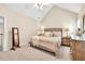 Cozy bedroom with vaulted ceiling, neutral decor, and plush carpeting at 4174 Chatham Crest Ln, Buford, GA 30518