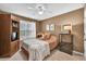 Bedroom with a ceiling fan, closet and large window offering plenty of natural light at 4174 Chatham Crest Ln, Buford, GA 30518