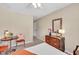 Bedroom featuring a bed, chairs, dresser and a window creating a peaceful retreat at 4174 Chatham Crest Ln, Buford, GA 30518
