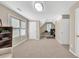 Spacious bonus room with neutral carpet, a ceiling fan, and windows for a comfortable and versatile area at 4174 Chatham Crest Ln, Buford, GA 30518