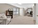 Spacious bonus room featuring neutral carpet, a ceiling fan, and windows creating a versatile space at 4174 Chatham Crest Ln, Buford, GA 30518