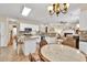 Open kitchen with stainless steel appliances, island, and eat-in area at 4174 Chatham Crest Ln, Buford, GA 30518