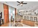 Open living area with hardwood floors, fireplace, and casual seating at 4174 Chatham Crest Ln, Buford, GA 30518