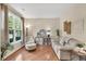 Comfortable living room featuring a large window for natural light and stylish decor at 4174 Chatham Crest Ln, Buford, GA 30518