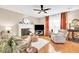 Bright living room with fireplace, hardwood floors, and natural light at 4174 Chatham Crest Ln, Buford, GA 30518