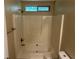 This bathroom has a shower and tub combo with white tile surround at 6536 Rebecca Lou Ln, Lithonia, GA 30058