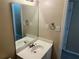 This bathroom offers a single sink with large mirror, with neutral walls at 6536 Rebecca Lou Ln, Lithonia, GA 30058
