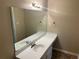 Bathroom with a large vanity and mirror, plus modern fixtures at 6536 Rebecca Lou Ln, Lithonia, GA 30058