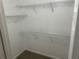 This walk-in closet provides shelving at 6536 Rebecca Lou Ln, Lithonia, GA 30058