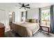 Serene bedroom with natural light, a ceiling fan, and soft blue curtains at 1682 Grace Se St, Atlanta, GA 30316